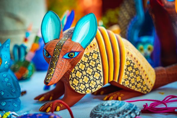 Oaxaca is famous for its crafts, including alebrijes, colorful wood-carved animals. 
