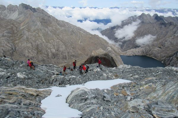 The Last Venezuelan Glacier team examines the recently exposed areas just below the Humboldt's glacier edge in 2019, more than 15,000 feet of elevation. 