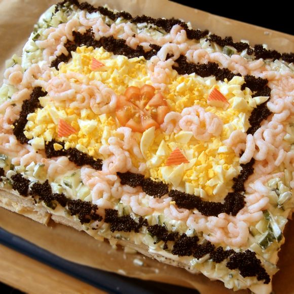 This sandwich cake comes with prawns, egg, caviar, and cucumber.