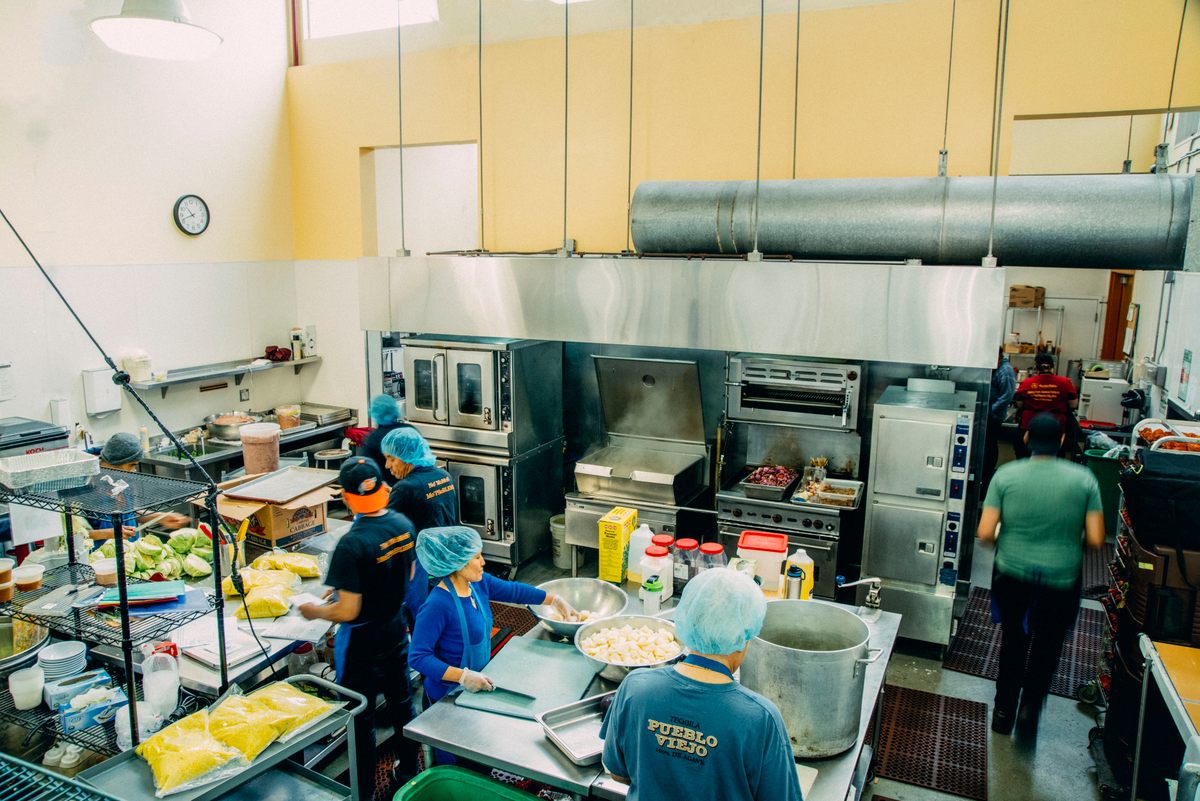 Chefs and aromas fill the bustling kitchen at La Cocina in San Francisco.