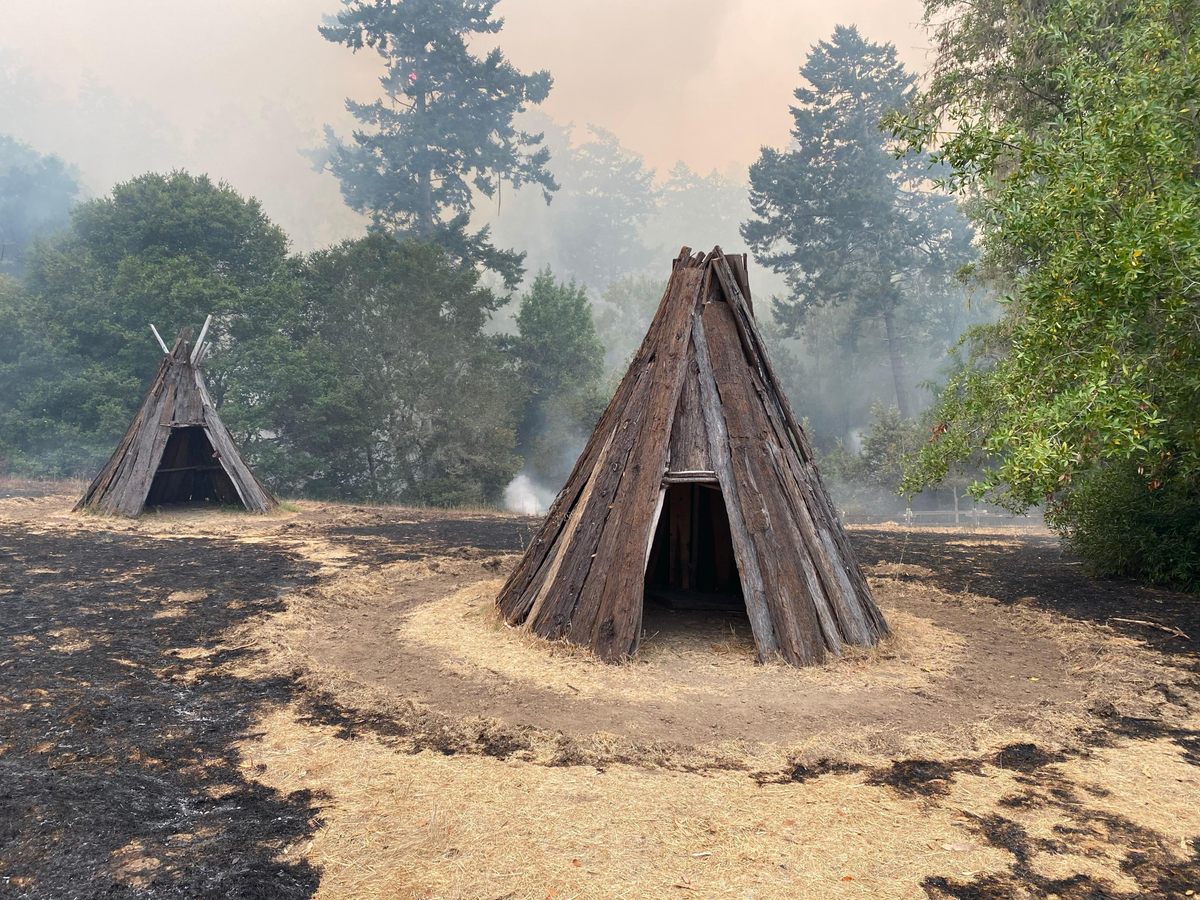 The recreated dwellings weren't burned—a perimeter, surrounded by dampened grasses, kept them safe.
