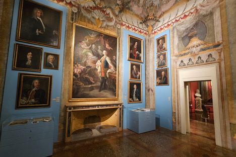 A room featuring portraits of opera performers from the 18th century.