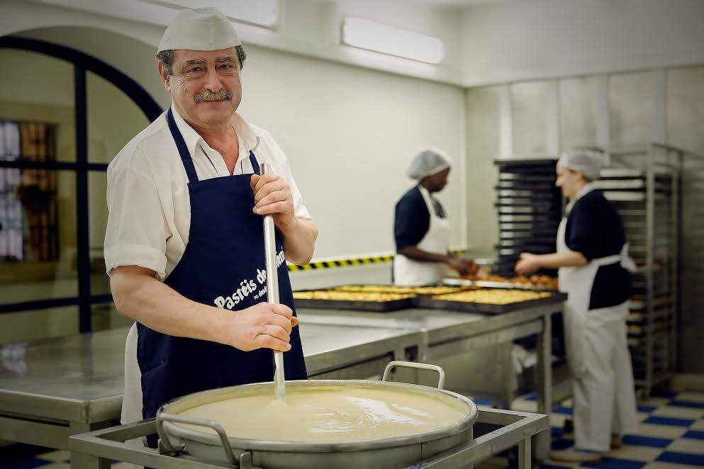 Mr. Victor Lopez stirs up Antiga Confeitaria de Belem's secret formula before baking begins.