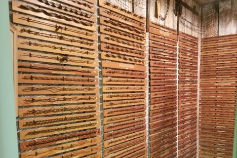 Wall of barbed wire samples.