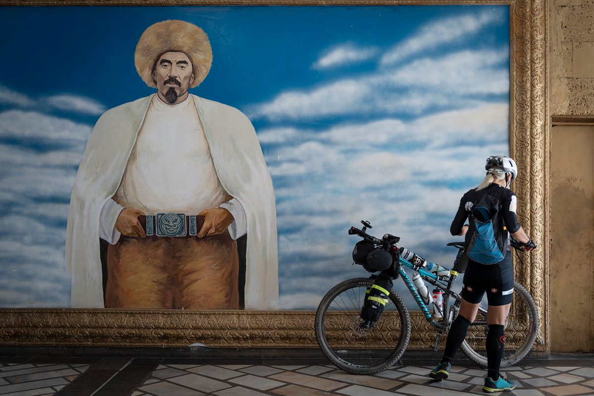 Bernarda Juric from Slovenia checks on her bike during registration in Bishkek.