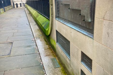 Looking down Cheney Row, with the measurements embedded in the wall