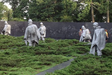 Wall behind soldiers. 