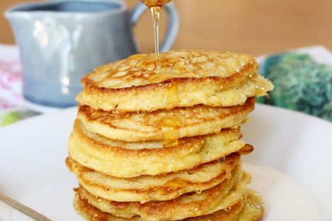 Cornmeal johnnycakes topped with honey.