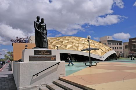 Pioneer Center for the Performing Arts and statue of a pioneer family.