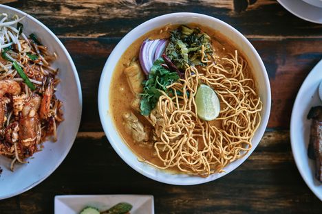 Khao soi, the popular northern Thai noodle dish, comes with a richly spiced coconut broth here.