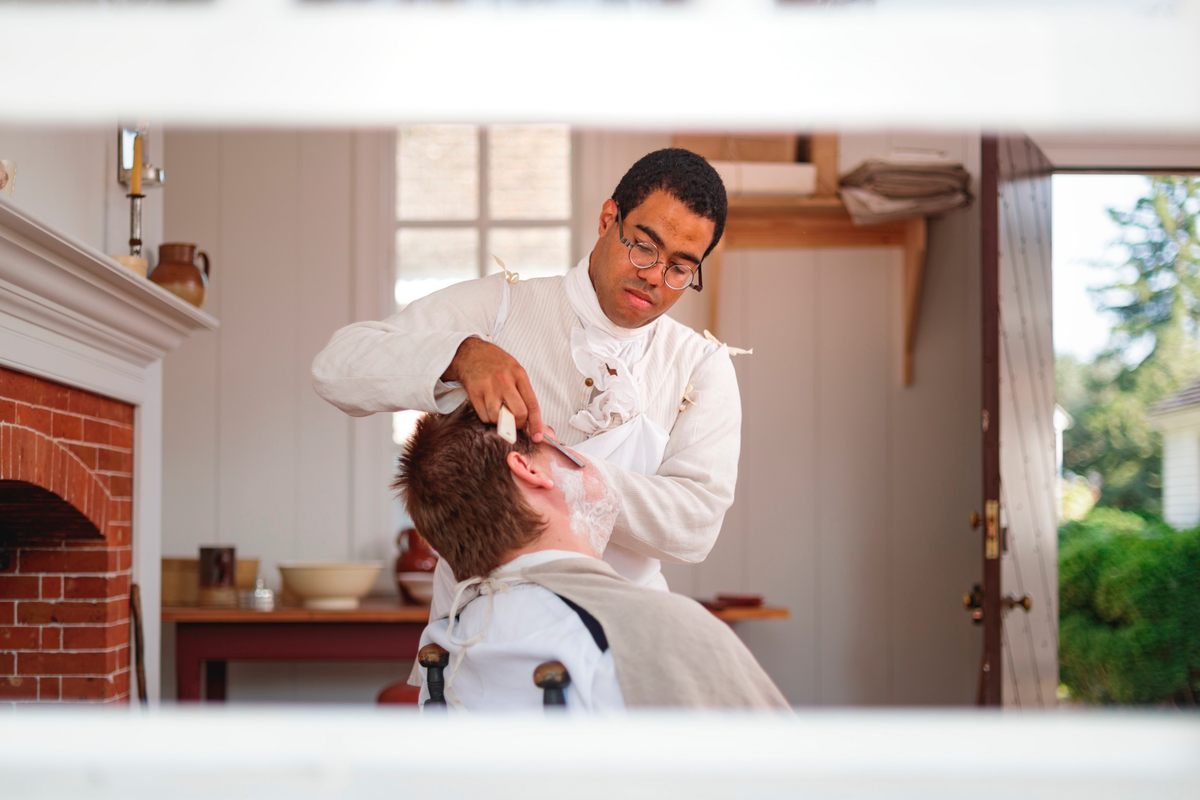 DeAndre Short in his role as formerly enslaved barber John Hope, also known as Caeser Hope.