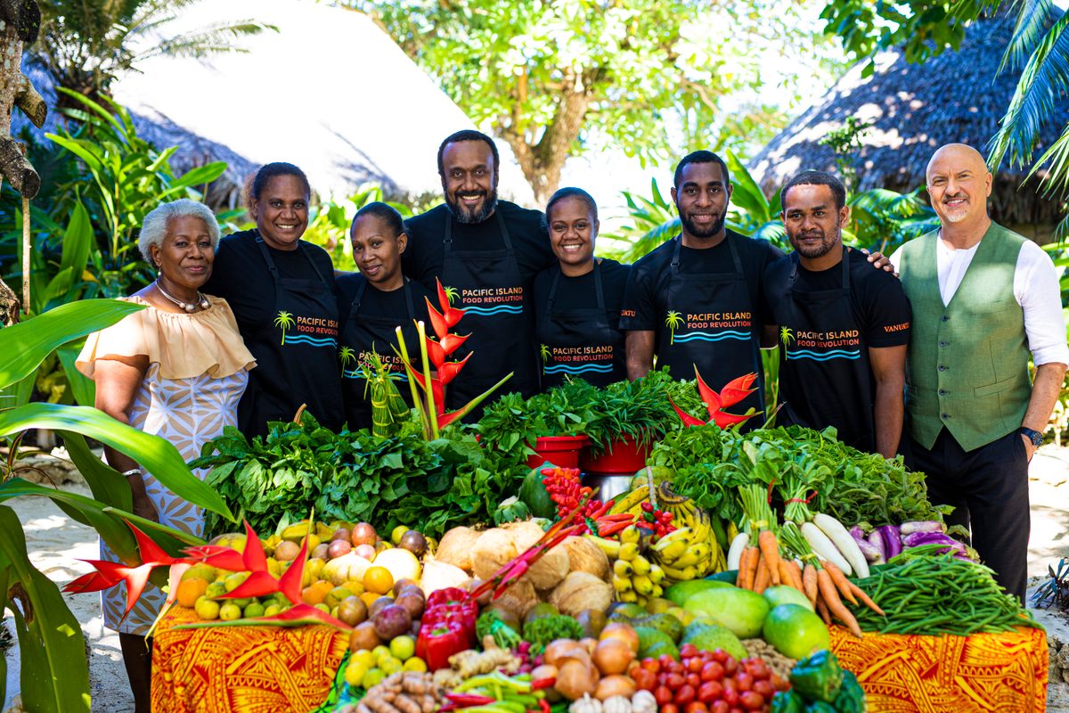 The season two teams from Vanuatu pose with Votausi Mackenzie-Reur and Oliver.