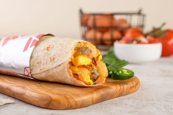 A freshly made burrito, with all the fixings.