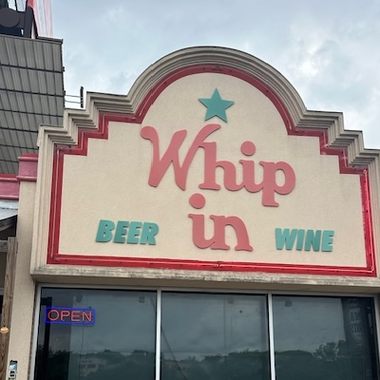 The exterior of Whip In.