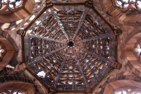 A stonemason and an industrial climber inspect the inside of the Freiburg Minster's steeple. 
