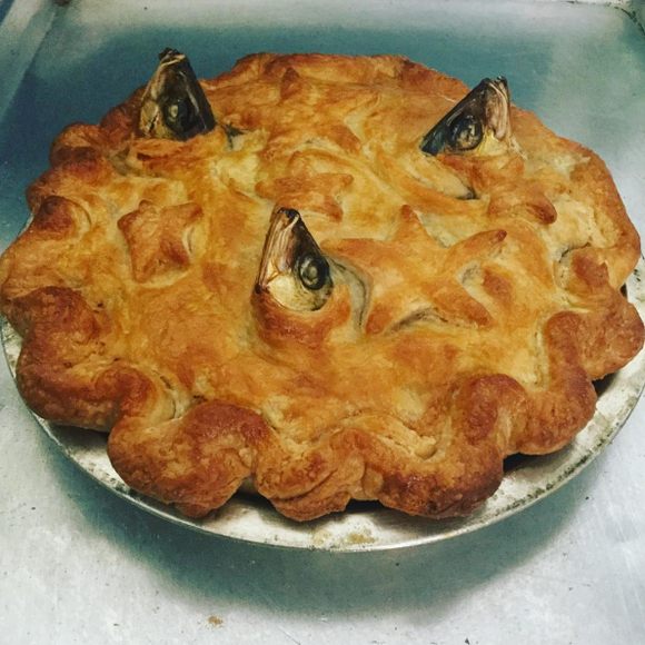 A perfect pie, complete with stars and fish heads.