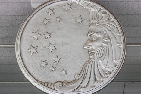 The original Procter & Gamble logo on a plaque.
