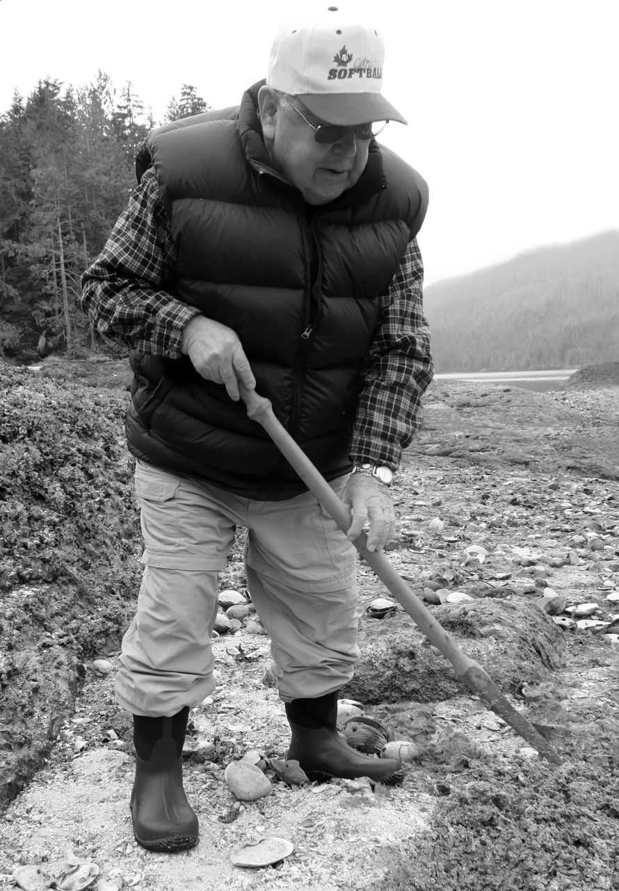 Clan Chief Kwaxsistalla Wathl’thla (Adam Dick) digs for clams in British Columbia. He had helped make clam gardens as a child in the same region.