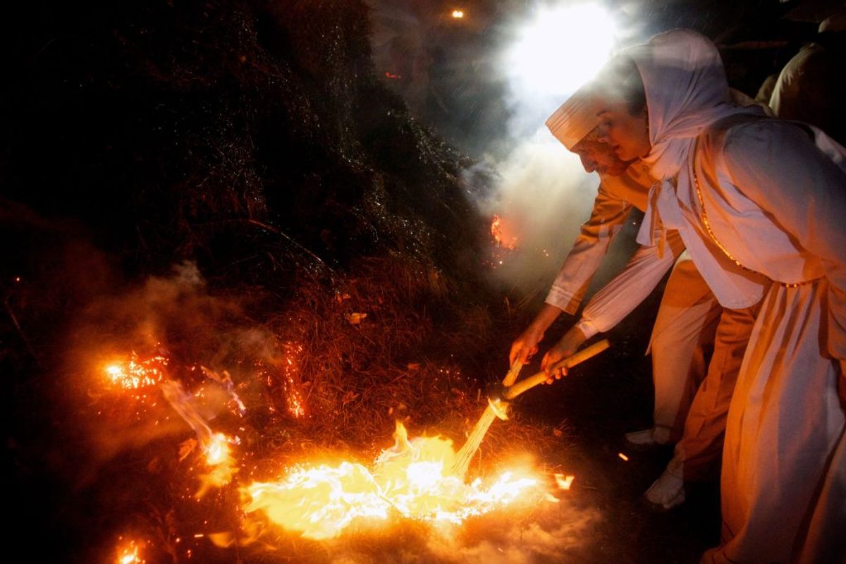 Zoroastrian priests set wood ablaze in celebration of the annual Sadeh festival in a western suburb of Tehran. This ancient Persian festival celebrates the defeat of the forces of darkness, frost, and cold. <em>Sadeh</em> means "one hundred," referring to the days and nights since the end of summer. (2013) 