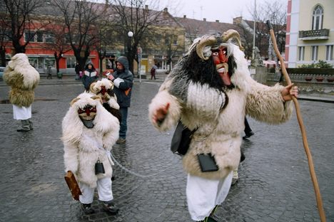 A monster with two smaller monsters in tow.