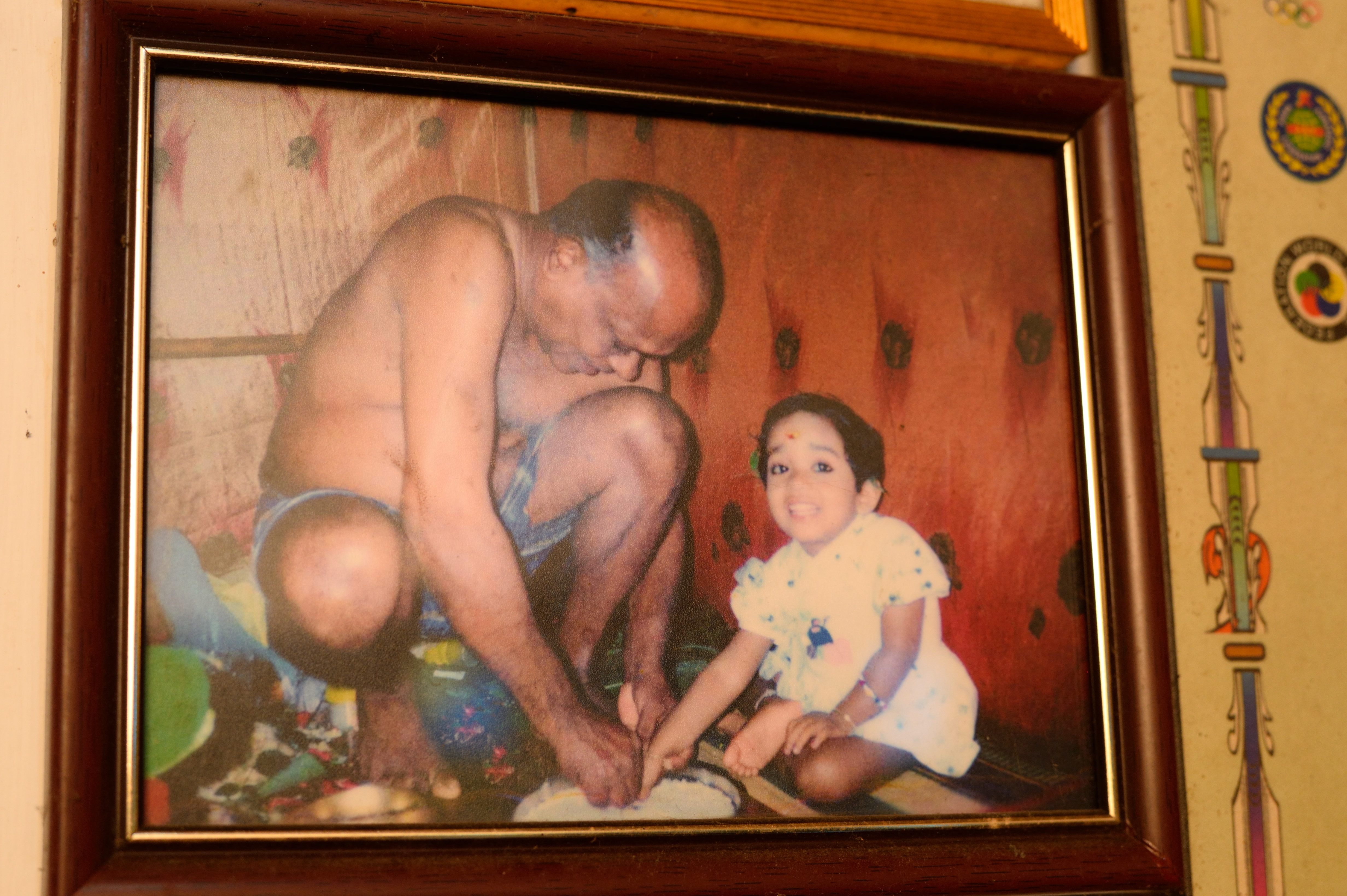 Meenakshi Amma, pictured here as a child with her father, started kalaripayattu at the traditional age of seven, despite the fact that few girls participated in the martial art when it reemerged in the mid 20th century.