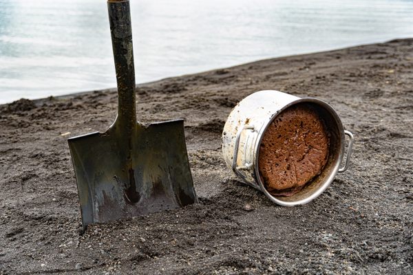 A recently-unearthed pot of rye bread sits on the shore of Lake Laugarvatn.