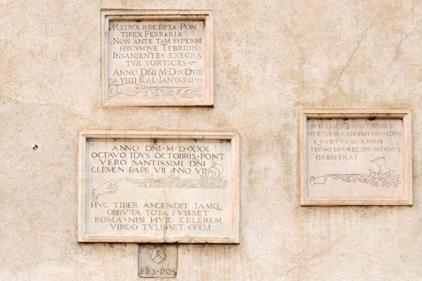 The plaques on the side of the church.