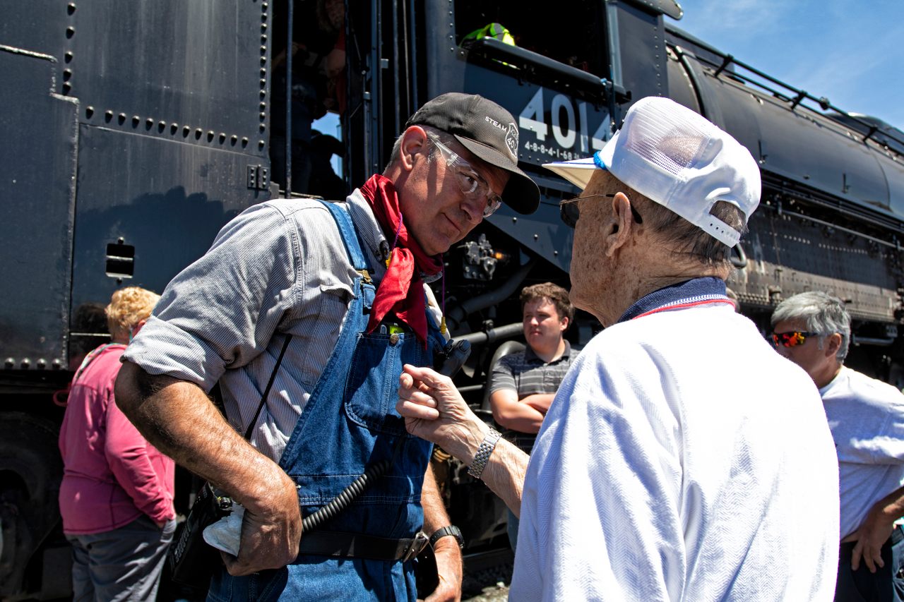 Ed Dickens (left) speaks with Merrill Transtrum (right), who drove the Big Boy in the 1940s and 1950s. 