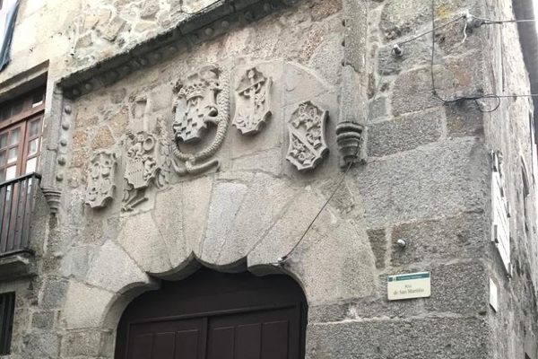 The portal with coats of arms of the former Seat of the Inquisition.