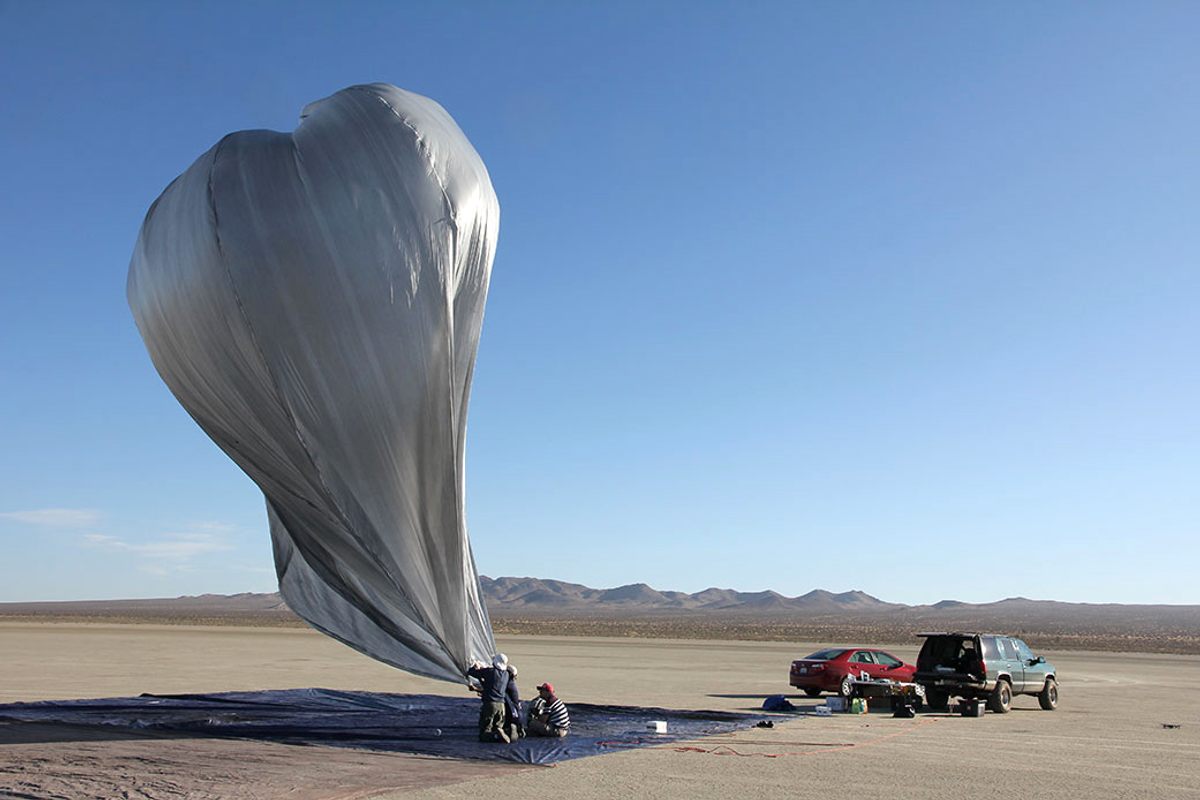 The balloons are darkened slightly to heat the air inside, lofting them up until dusk, when they cool and descend.