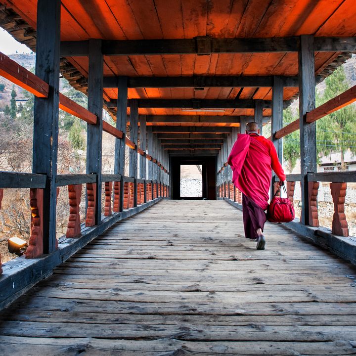 Monk walking towards Rinpung Monastery in Paro.