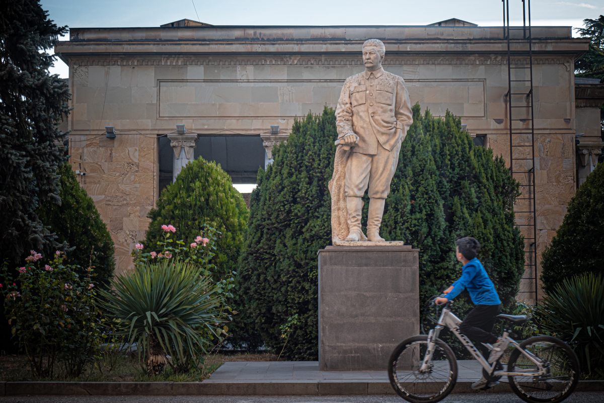 One of the four remaining publicly displayed Stalin statues in Gori stands outside the Stalin Museum.