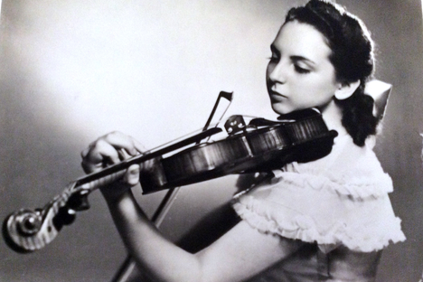 Bernice Stochek Friedson in 1948, aged 16, playing one of her father's violins.