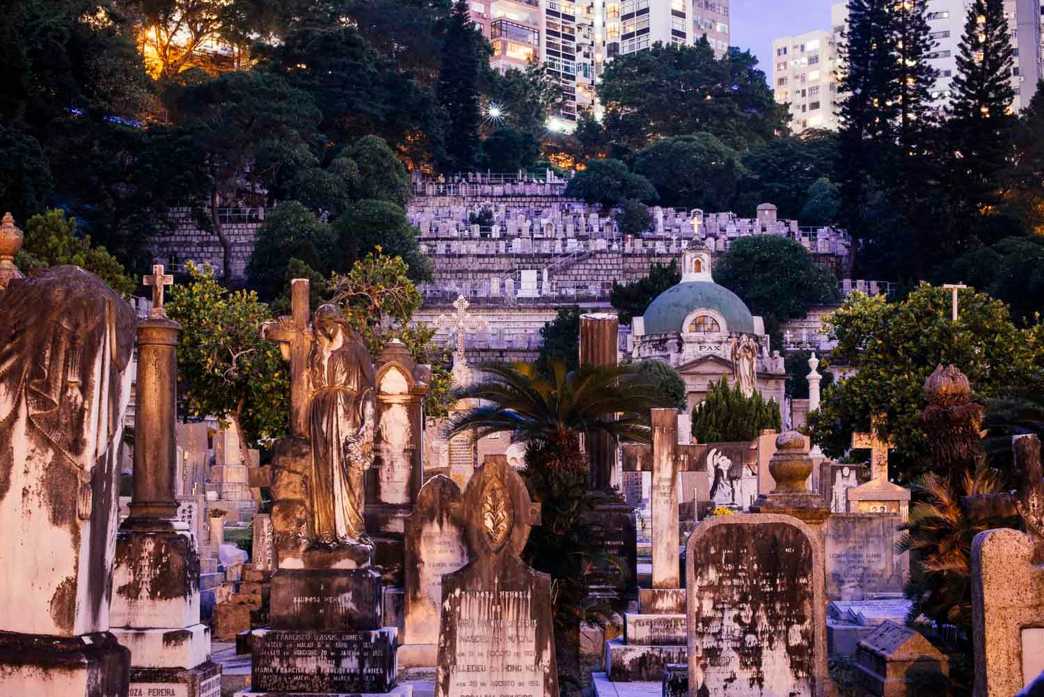 Many graves in St. Michael's crowd together, evidence of the city's decreasing space for burials. Hong Kong's overcrowded cemeteries darkly mirror its squeezed real estate market.