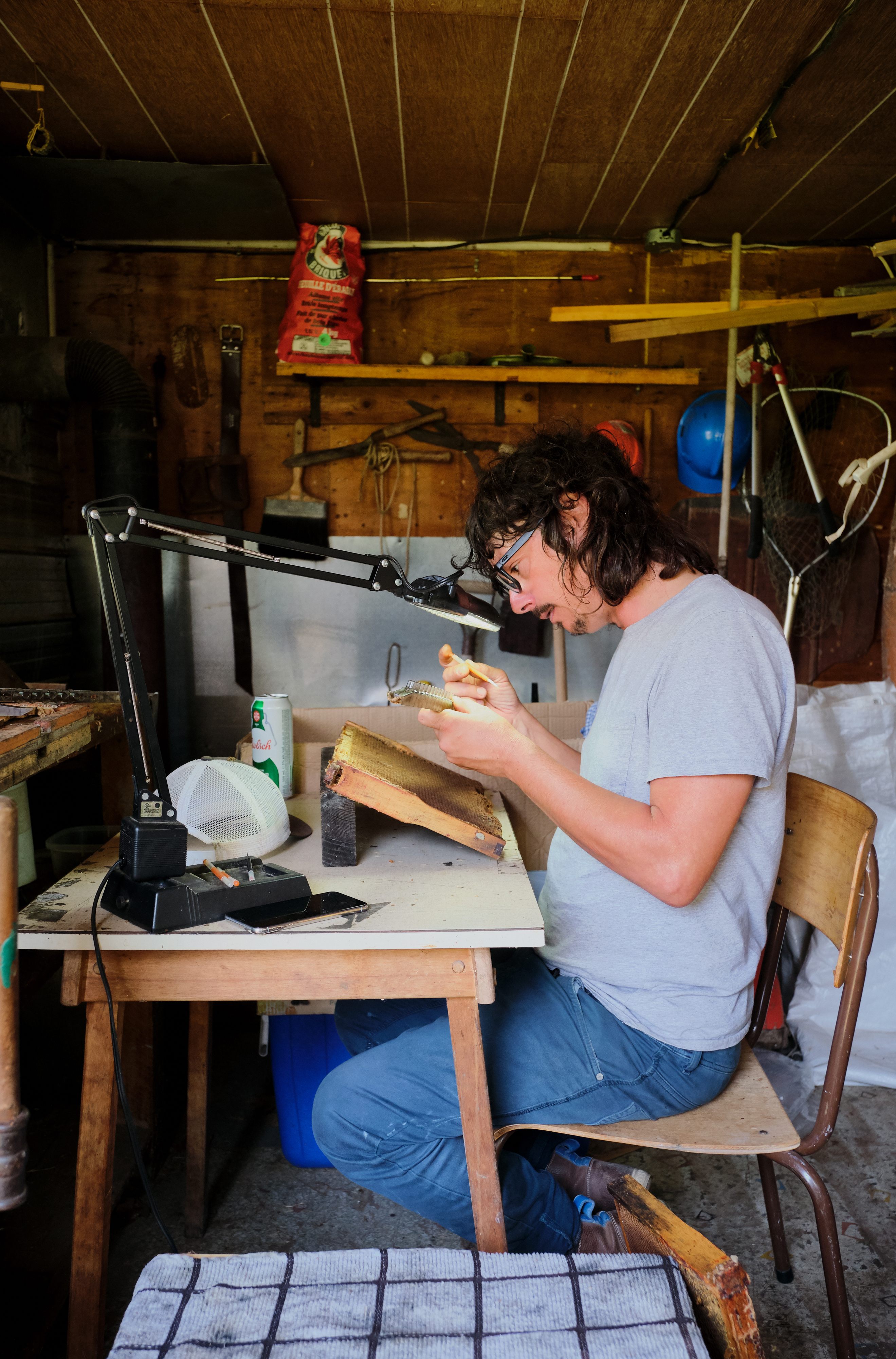 Anicet Desrochers grafts larvae using a special tool from China.
