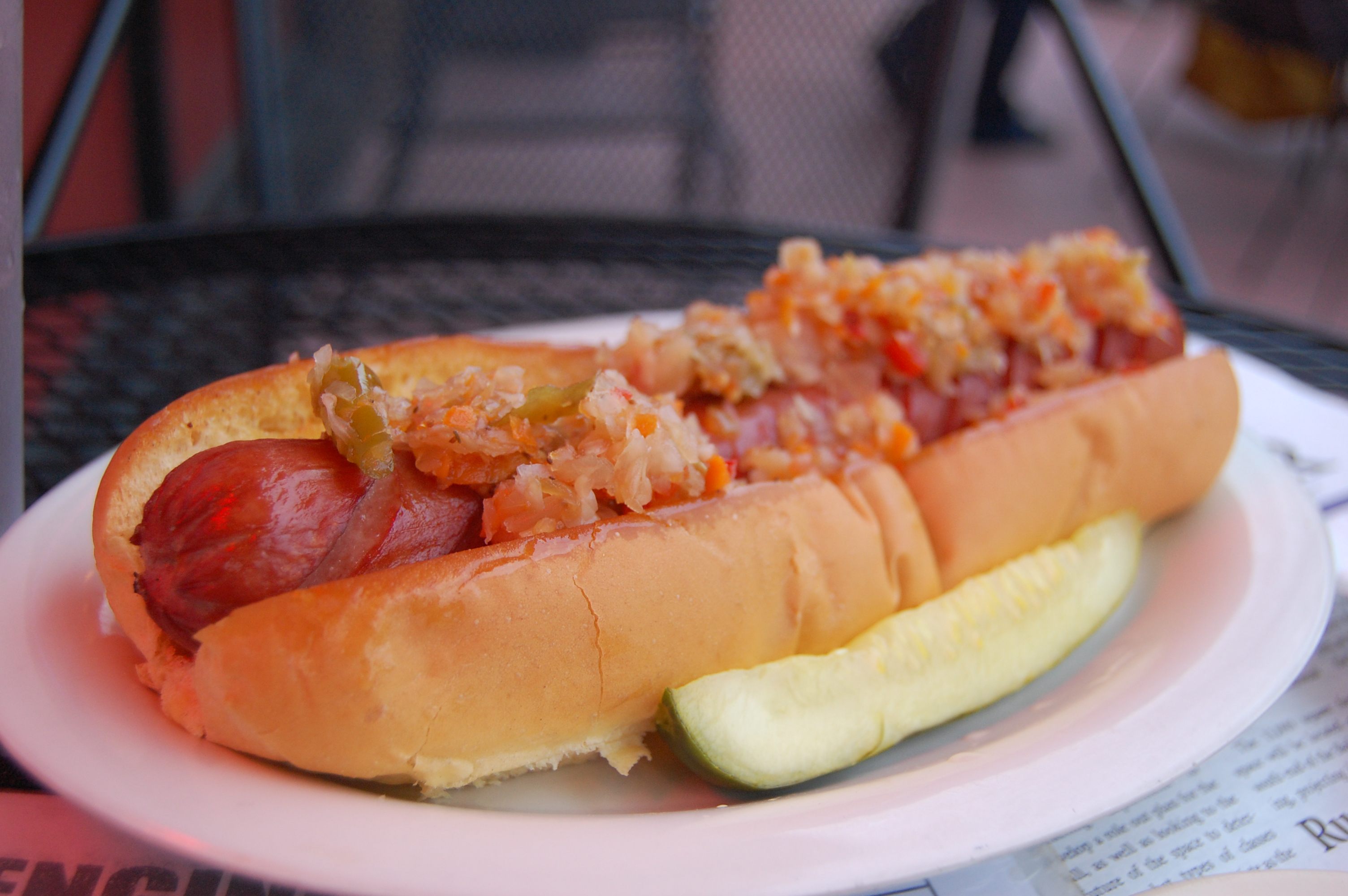 A generous dollop of chow chow lines a hot dog.