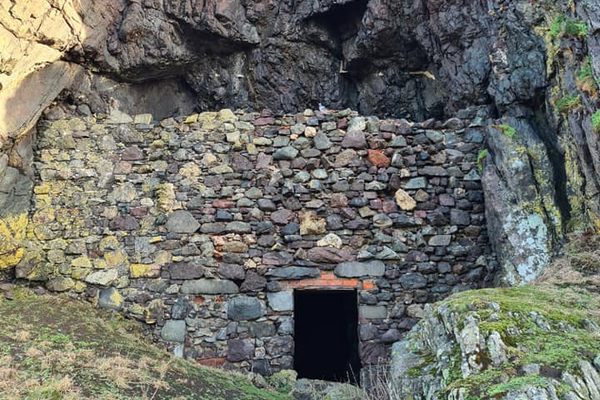The masonry wall entrance to Snib's Cave