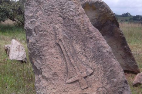 Monolith with knife bas relief.