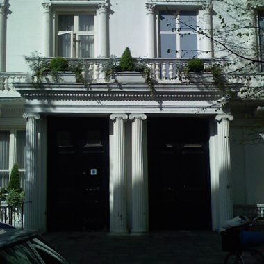 The left-hand property (No. 22) is inhabited, but the right-hand one (No. 23) is only a façade.