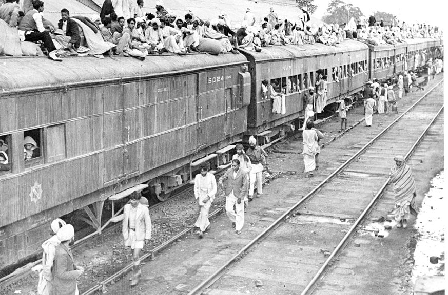 A train overflows with refugees during Partition.