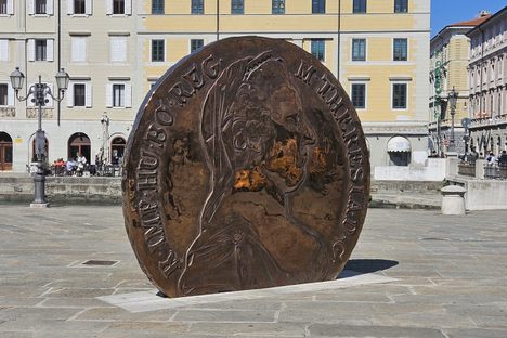 The Maria Theresa Thaler, with the statue of James Joyce in the background on the right.