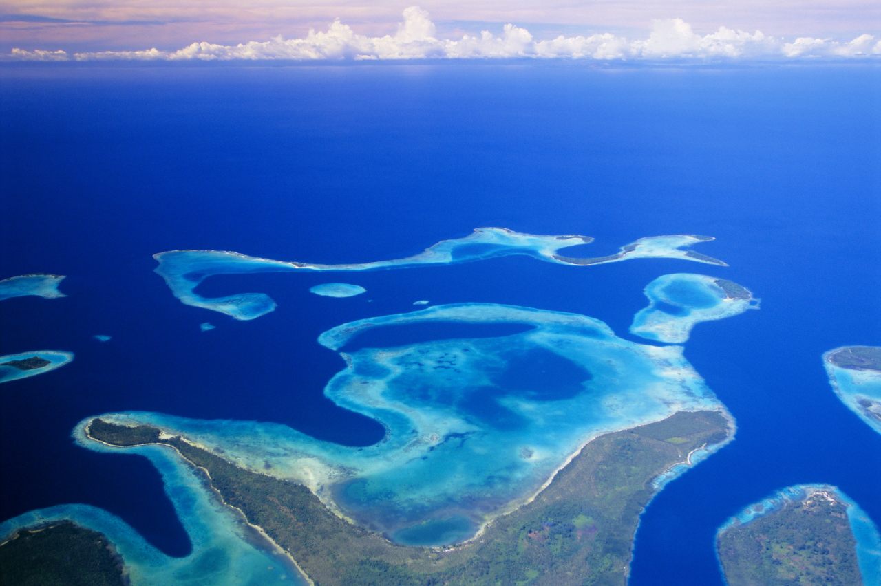 The Solomon Islands include both low-lying atolls and larger landmasses. 