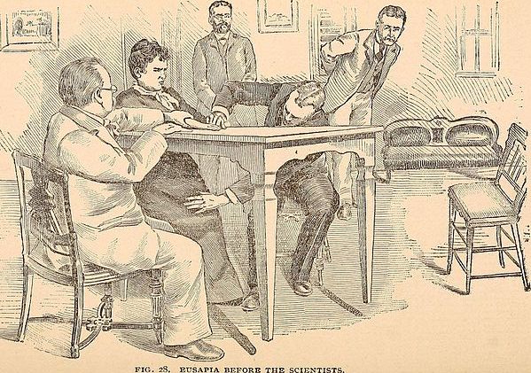 An illustration from the 1897 book "Hours with the ghosts, or, Nineteenth century witchcraft: illustrated investigations into the phenomena of spiritualism and theosophy", showing scientists investigating the claims of a spirit medium