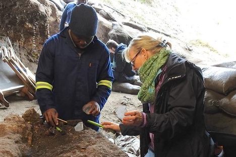 Archaeologists Joshua Kumbani (left) and Sarah Wurz (right) work at a site near the Klasies River in South Africa.