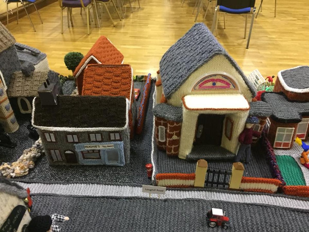 The building on the right is the town's Orange Hall, in which the model village is displayed.