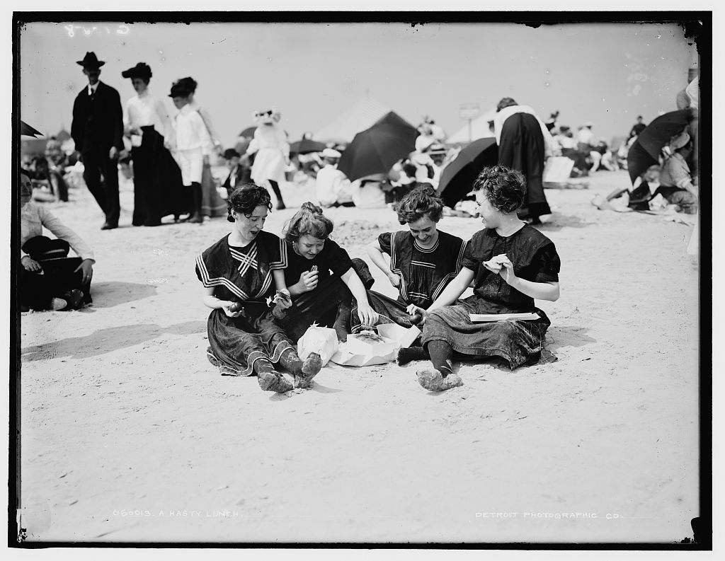 Women, like these picnickers at Coney Island Brooklyn, c. 1900, were expected to cover up when swimming. 