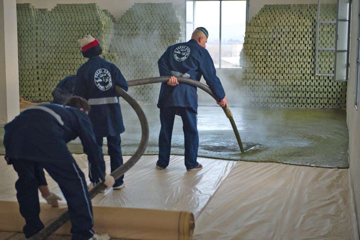 The soap in its liquid form is poured onto the stone floors of drying chambers, forming a thick carpet of green gloop the size of a tennis court.