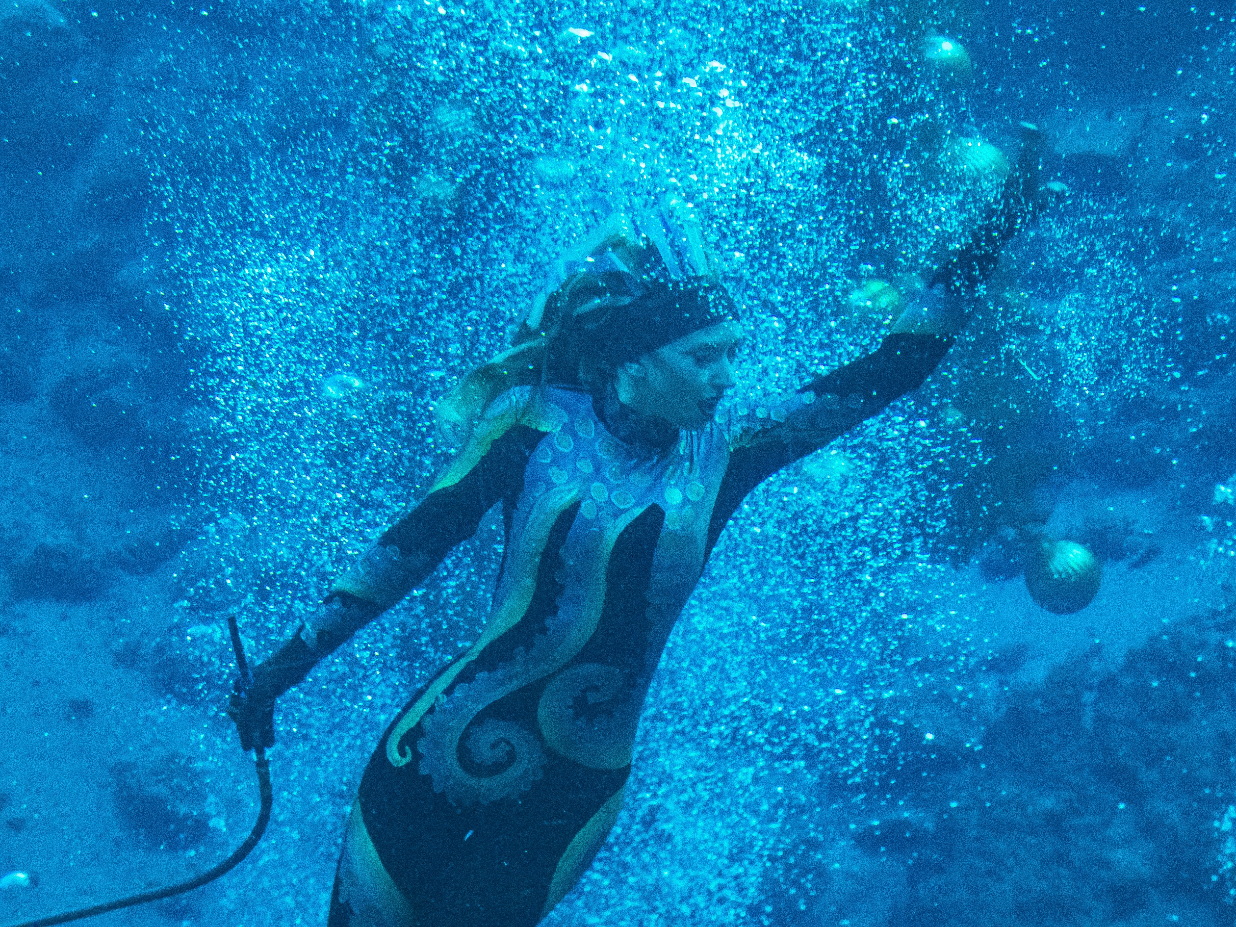 Ursula cuts through a cluster of bubbles in The Little Mermaid.