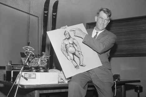 Famed mountaineer Edmund Hillary displays a rendering of a yeti at a 1960 news conference before departing on his expedition in the Himalayas.