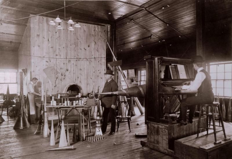 What recording a song looked like in 1905. Here, a piano player records directly into a phonograph horn, which carves the music directly onto a 78 record.